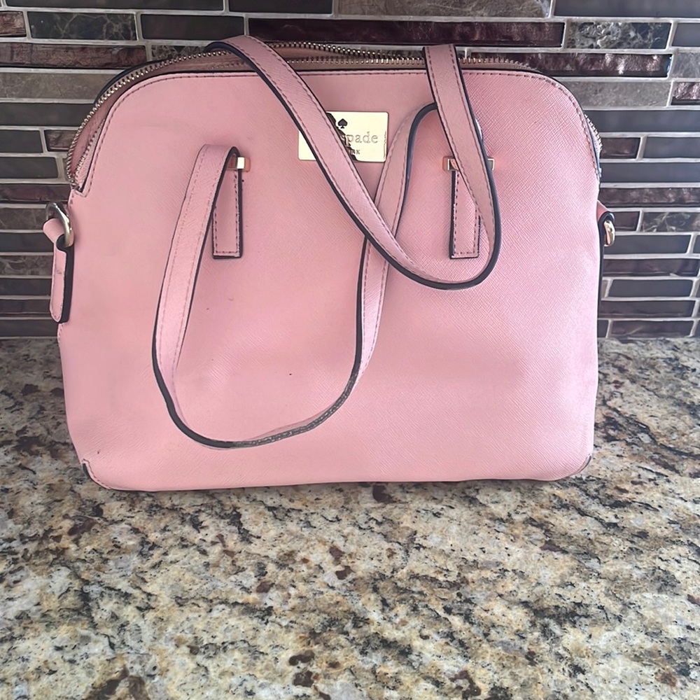 Kate spade purse pink - has pen marks on the inside